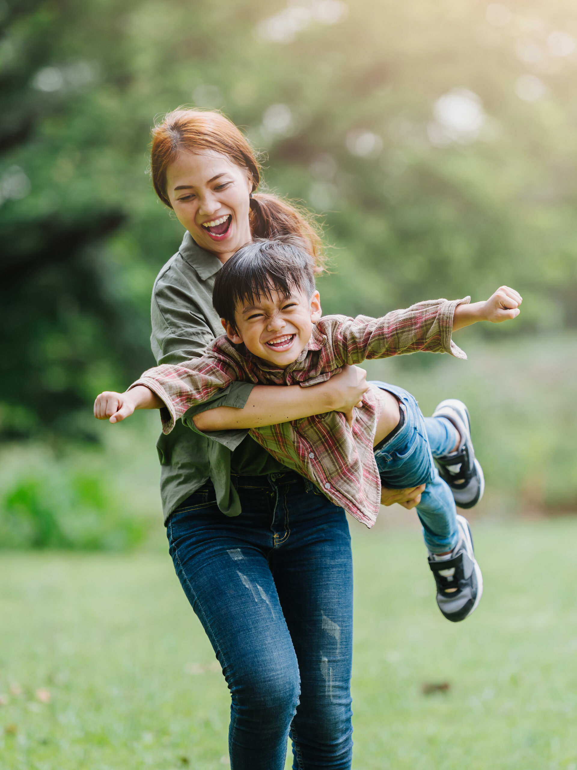 Child and mom play outdoors together